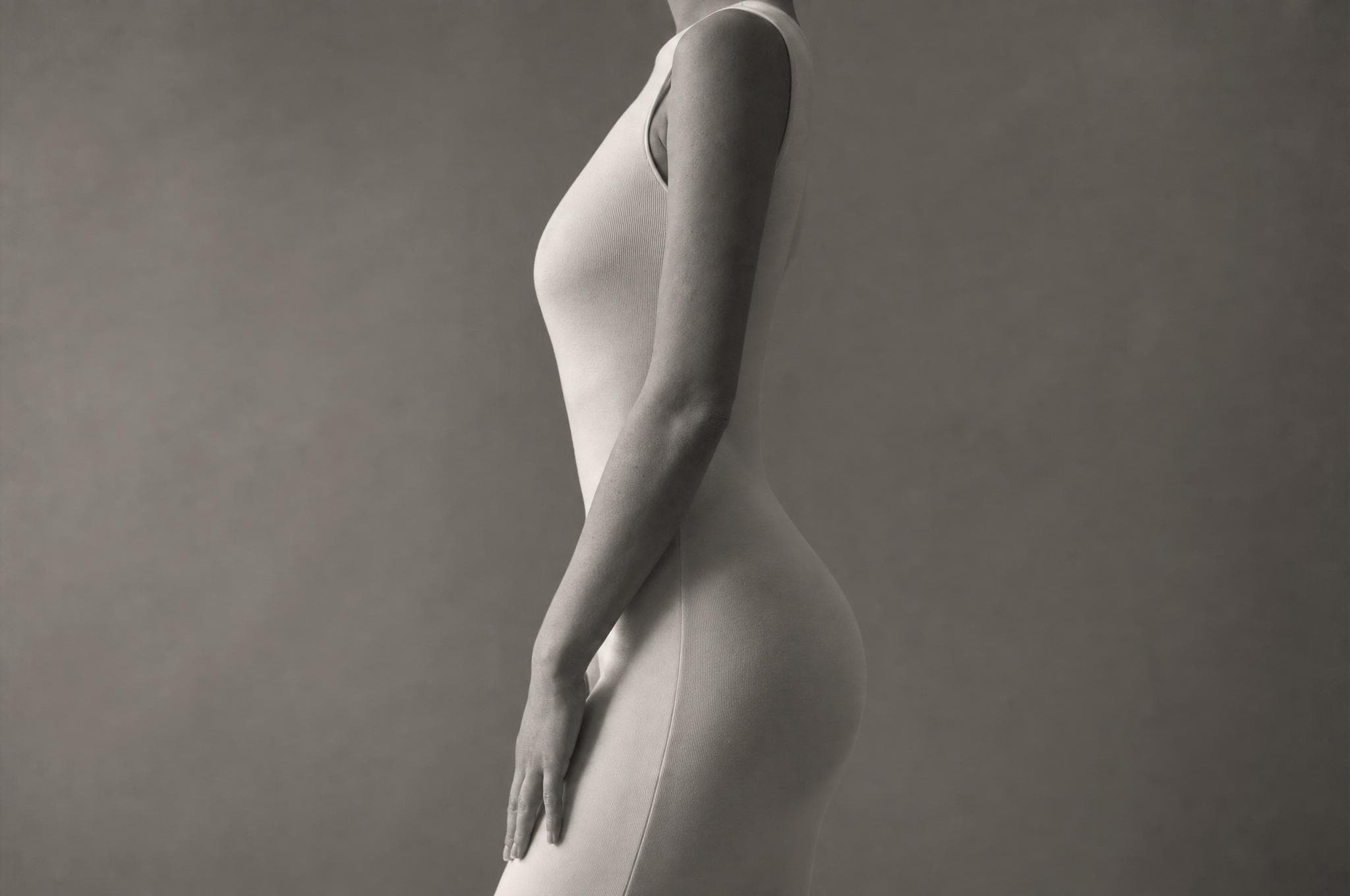 Silk drape flowing over a reclining form like soft dunes